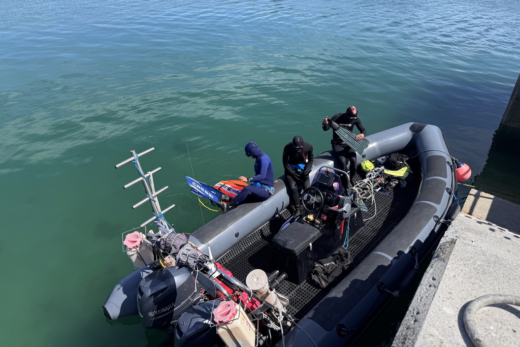 Three Freedivers are getting ready for boat ride to explore Atlantic around Inishmore, Aran Islands