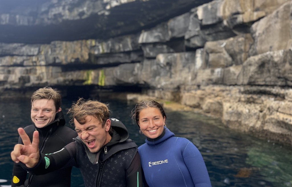 excited scuba divers on the boat before go scuba diving near Inishmore, aran islands