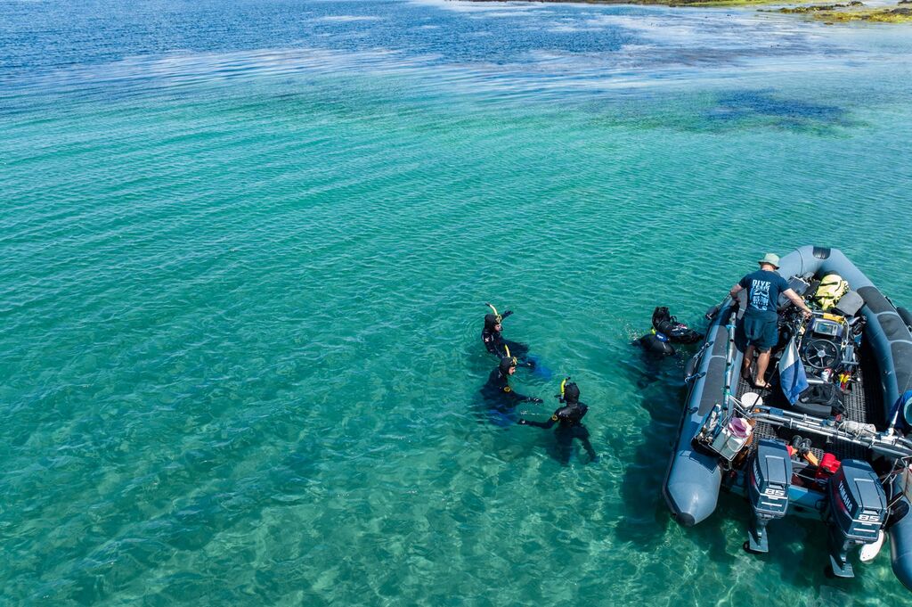 snorkellers in the water getting ready to explore underwater marine life around aran islands