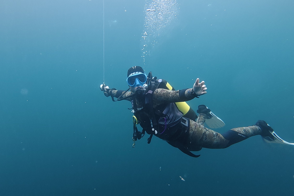 Scuba diver enjoying safety stop during last minutes of dive