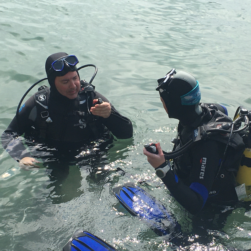 two scuba divers practicing scuba skills in the water near dive aran, inishmore, aran islands