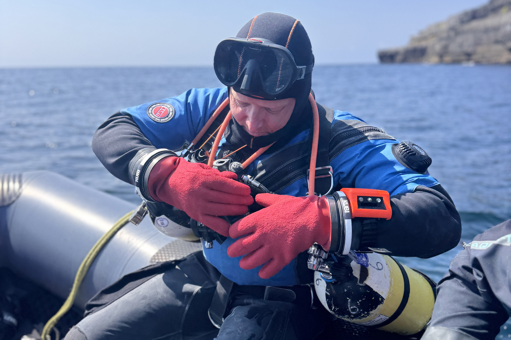 Three scuba divers during their Try Dive experience